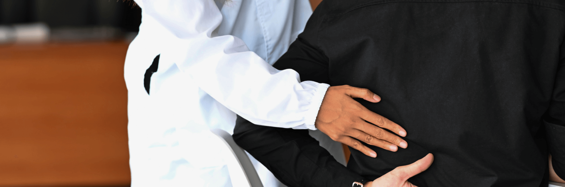 treating back pain with TCM - doctor treating man for back pain