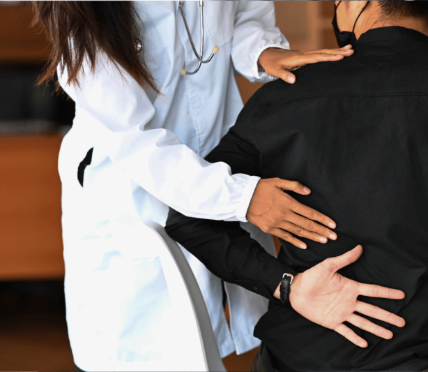 treating back pain with TCM - doctor treating man for back pain